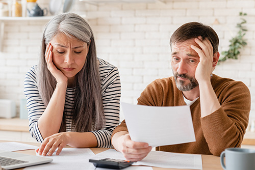 Parent and student reviewing college financing options and comparing loan types